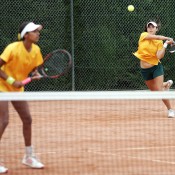 Naiktha Bains (L) and Isabelle Wallace in action in the doubles rubber against Latvia at the Junior Fed Cup world finals; photo Srdjan Stevanovic