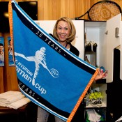 Alicia Molik poses with Hopman Cup merchandise backstage at the Perth Arena Open Day; Tennis Australia