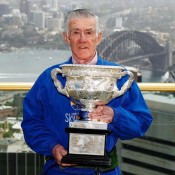 Ken Rosewall poses with the Australian Open men's singles trophy during the Australian Open Trophy Tour at Sky Walk, Sydney Tower in Sydney, Australia; Getty Images