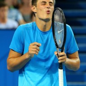 Bernard Tomic of Australia looks on after missing a shot in the mixed doubles match partnered with Ashleigh Barty against Novak Djokovic and Ana Ivanovic of Serbia during day five of the Hopman Cup at Perth Arena on January 2, 2013 in Perth, Australia; Getty Images