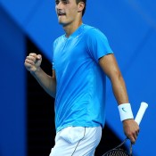 Bernard Tomic of Australia celebrates winning a point in his singles match against Novak Djokovic of Serbia on Day 5 of the Hopman Cup at Perth Arena; Getty Images
