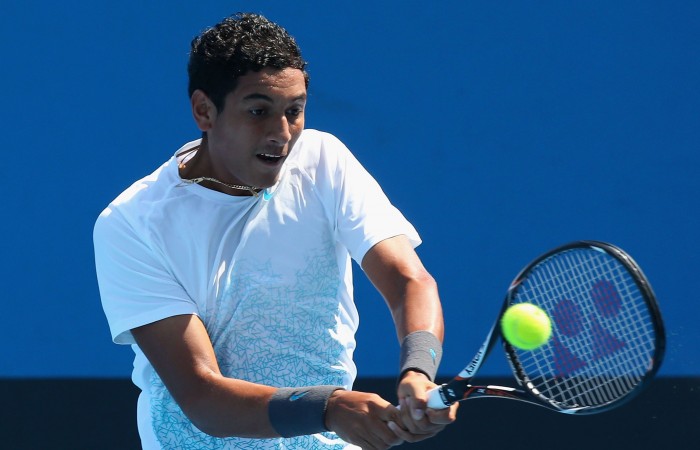 Nick Kyrgios of Australia plays a backhand in his first round match against Cem Ilkel of Turkey during the 2013 Australian Open Junior Championships at Melbourne Park on January 20, 2013 in Melbourne, Australia; Getty Images