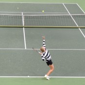 Fed Cup captain Alicia Molik serves during the Australian team's practice session; Tennis Australia