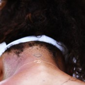 A tattoo of a heart is shown on the neck of Serena Williams as she sits down between games during her three-set win over Dominika Cibulkova of Slovakia in the fourth round of the Sony Open in Key Biscayne, Florida; Getty Images