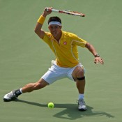 Kei Nishikori of Japan plays a flamboyant forehand during his fourth round loss against David Ferrer at the Sony Open in Key Biscayne, Florida; Getty Images