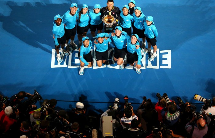 Novak Djokovic poses with ballkids after his victory at Australian Open 2013. GETTY IMAGES