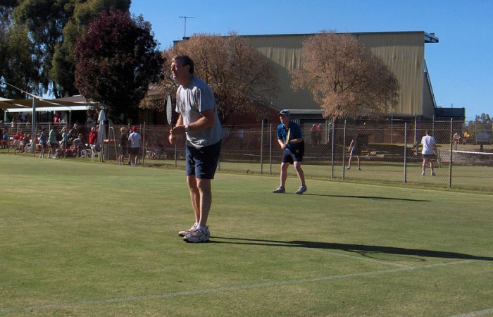 John Christiansen and Cameron Christansen, step father and step son, in doubles action at the Echuca Lawn Tennis Club annual Easter tournament; Robyn Christiansen 