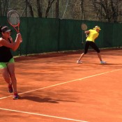 Casey Dellacqua (L) and Alicia Molik in action; Tennis Australia