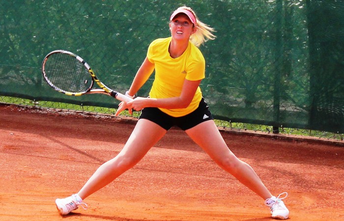 Storm Sanders slides into a shot on the red clay of Tennis Club Chiasso during an Australian Fed Cup team practice session; Tennis Australia