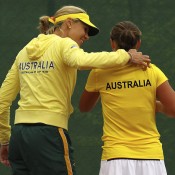 Australian Fed Cup captain Alicia Molik (L) congratulates Ash Barty on defeating Stefanie Voegele, her first Fed Cup win and which came in her singles debut for Australia; Getty Images