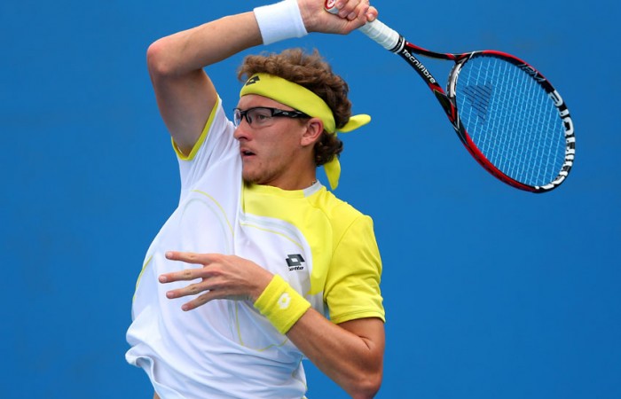 Denis Istomin of Uzbekistan plays a forehand in his second round match against Andreas Seppi of Italy on Day 4 of Australian Open 2013 at Melbourne Park; Getty Images