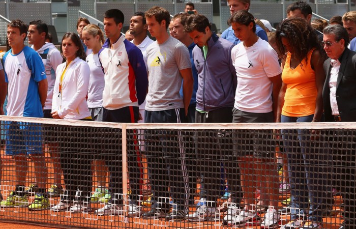 ATP and WTA players in Madrid stand together for a minute's silence to honour Brad Drewett. GETTY IMAGES