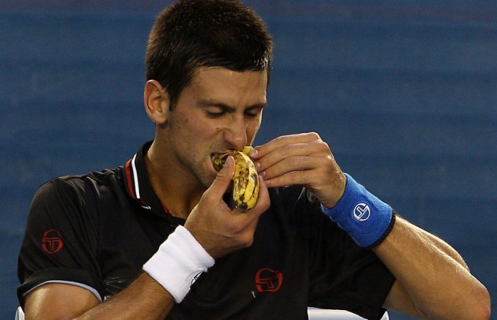 Novak Djokovic eats a banana during Australian Open 2012; Getty Images