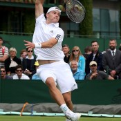 James Duckworth flies for a smash during his gallant five-set loss to Denis Kudla. GETTY IMAGES