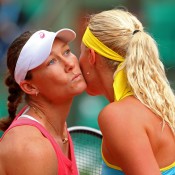 Sam Stosur (L) kisses Kristina Mladenovic after defeating the Frenchwoman 6-4 6-3 in the second round of the French Open at Roland Garros; Getty Images
