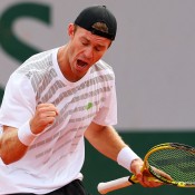John Peers celebrates a point during his second round men's doubles loss with partner Jamie Murray to Colombians Juan Sebastian Cabal and Robert Farah of Columbia at the French Open; Getty Images