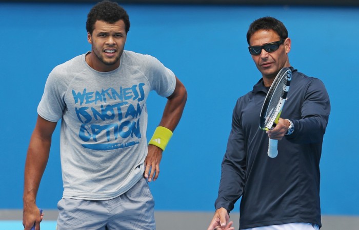 Jo-Wilfried Tsonga with coach Roger Rasheed (R) during a practice session ahead of the 2013 Australian Open at Melbourne Park; Getty Images