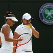 Ashleigh Barty (R) and Casey Dellacqua discuss tactics during their semifinal win over No.7 seeds Anna-Lena Groenefeld and Kveta Peschke; Getty Images