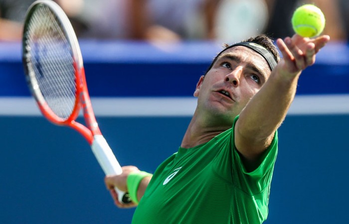 Marinko Matosevic prepares to serve against Ryan Harrison at the BB&T Atlanta Open; Getty Images