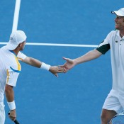 Lleyton Hewitt (L) and Chris Guccione celebrate a winning point during their 6-1 6-2 victory over Rajeev Ram and Ken Skupski in the doubles quarterfinals at the BB&T Atlanta Open; Getty Images