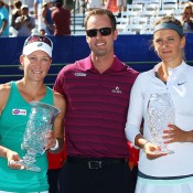 Sam Stosur (L) and Victoria Azarenka (R) pose with La Costa Resort and Spa's director of tennis Brandon Sieh following Stosur's 6-2 6-3 victory in the final of the Southern California Open in Carlsbad, California; Getty Images