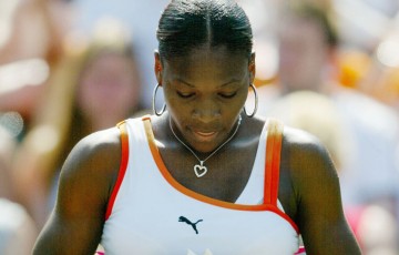 Serena Williams of the U.S. reads a letter during her match against Laura Granville of the U.S. during day six of the Wimbledon Tennis Championships at the All England Lawn Tennis Club on June 28, 2003 in London; Getty Images