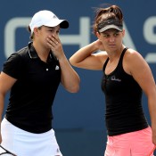 Ash Barty (L) and Casey Dellacqua of Australia talk tactics during their 6-3 6-4 second round win against Petra Cetkovska of Czech Republic and Kirsten Flipkens of Belgium at the 2013 US Open; Getty Images