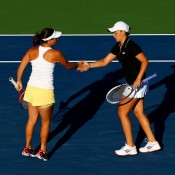 Casey Dellacqua (L) and Ash Barty urge each other on during their 6-2 6-2 women's doubles semifinal victory over Sania Mirza of India and Jie Zheng of China at the 2013 US Open in New York; Getty Images