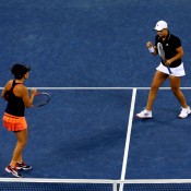 Ash Barty (R) and Casey Dellacqua of Australia won the first set of their US Open women's doubles final against Czechs Andrea Hlavackova and Lucie Hradecka  on Arthur Ashe Stadium; Getty Images