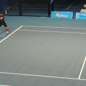 Adam Feeney in action at the Cairns Tennis International Pro Tour event; Tennis Australia