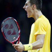 Bernard Tomic celebrates winning the second set against Lukasz Kubot in the first reverse singles rubber of the Davis Cup tie between Poland and Australia; Getty Images