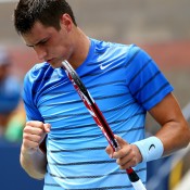 Celebrating a winning point, Bernard Tomic recovered from a deficit to eventually beat Albert Ramos 6-3 3-6 4-6 7-6(1) 6-3 to move into the second round of the US Open; Getty Images