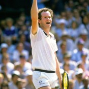 John McEnroe celebrates winning the 1984 Wimbledon title over rival Jimmy Connors, part of an incredible season that saw the American win 82 of his 85 matches and also capture the US Open title. His winning percentage of .965 remains an ATP record; Allsport