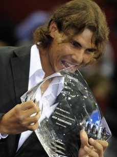 Spanish player Rafael Nadal holds the trophy that symbolizes his ranking as World No. 1 since August 18, 2008 on October 12, 2008 at a ceremony celebrated during the Masters Series of Madrid. AFP PHOTO/Pedro ARMESTRE. (Photo credit should read PEDRO ARMESTRE/AFP/Getty Images)