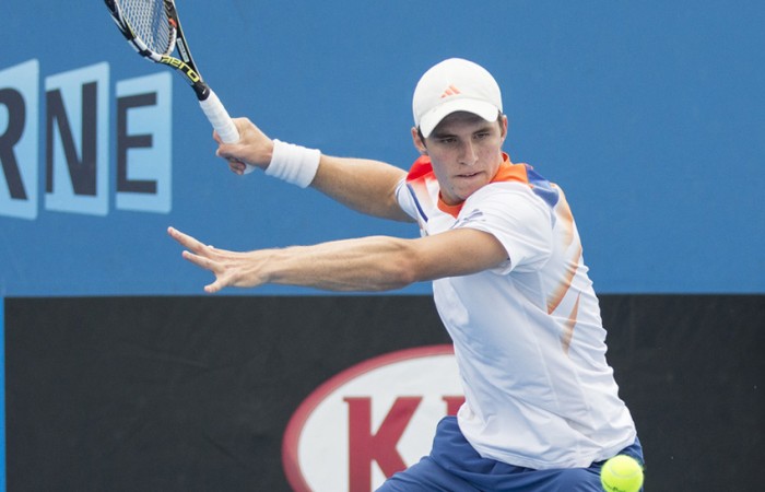 Ben Mitchell in action during the Australian Open Play-off at Melbourne Park; Emily Mogic