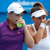 MELBOURNE, AUSTRALIA - JANUARY 16:  Casey Dellacqua of Australia and Ashleigh Barty of Australia talk tactics in their first round doubles match against Alexandra Panova of Russia and Karolina Pliskova of the Czech Republic  during day four of the 2014 Australian Open at Melbourne Park on January 16, 2014 in Melbourne, Australia.  (Photo by Scott Barbour/Getty Images)