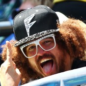 MELBOURNE, AUSTRALIA - JANUARY 20:  Singer Stefan Gordy, aka Redfoo watches Victoria Azarenka of Belarus in her fourth round match against Sloane Stephens of the United States during day eight of the 2014 Australian Open at Melbourne Park on January 20, 2014 in Melbourne, Australia.  (Photo by Ryan Pierse/Getty Images)