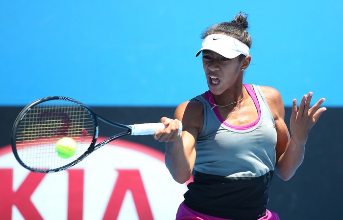 MELBOURNE, AUSTRALIA - JANUARY 21:  Destanee Aiava of Australia plays a forehand in her second round junior girls' match against Katrine Steffensen of the United States during the 2014 Australian Open Junior Championships at Melbourne Park on January 21, 2014 in Melbourne, Australia.  (Photo by Chris Hyde/Getty Images)