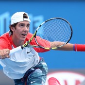 Thanasi Kokkinakis of Australia plays a forehand in his first round match against Igor Sijsling of the Netherlands during day two of the 2014 Australian Open at Melbourne Park on January 14, 2014 in Melbourne, Australia.  (Photo by Michael Dodge/Getty Images)