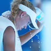 Caroline Wozniacki of Denmark cools off after winning her first round match against Lourdes Dominguez Lino of Spain during day two of the 2014 Australian Open at Melbourne Park on January 14, 2014 in Melbourne, Australia.  (Photo by Quinn Rooney/Getty Images)
