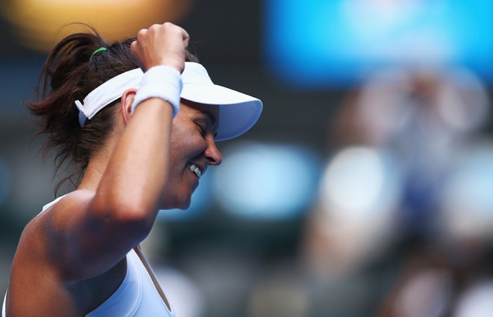 MELBOURNE, AUSTRALIA - JANUARY 17:  Casey Dellacqua of Australia celebrates winning her third round match against Jie Zheng of China during day five of the 2014 Australian Open at Melbourne Park on January 17, 2014 in Melbourne, Australia.  (Photo by Ryan Pierse/Getty Images)