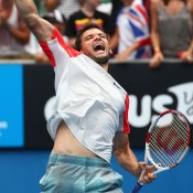 MELBOURNE, AUSTRALIA - JANUARY 18:  Grigor Dimitrov of Bulgaria celebrates winning his third round match against Milos Raonic of Canada during day six of the 2014 Australian Open at Melbourne Park on January 18, 2014 in Melbourne, Australia.  (Photo by Robert Prezioso/Getty Images)