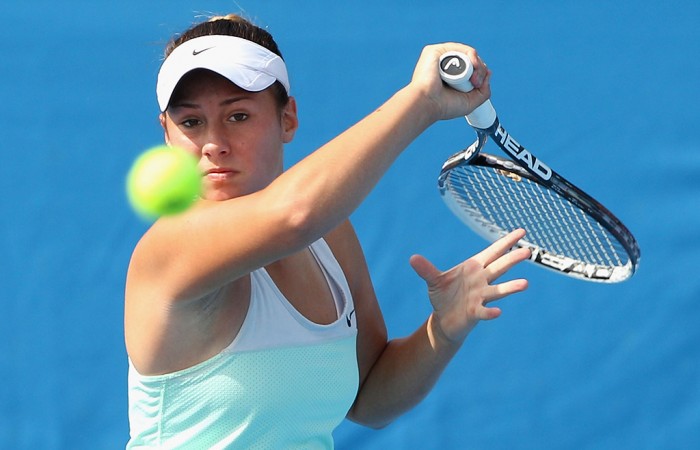 MELBOURNE, AUSTRALIA - JANUARY 09:  Sara Tomic of Australia plays a forehand in her match against Tamira Paszek of Austria during qualifying for the 2014 Australian Open at Melbourne Park on January 9, 2014 in Melbourne, Australia.  (Photo by Robert Prezioso/Getty Images)