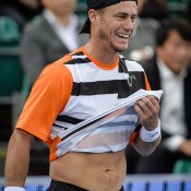 Lleyton Hewitt of Australia laughs during a tennis exhibition game against Tomas Berdych of the Czech Republic in Hong Kong on March 3, 2014. Hewitt won 6-4, 7-5; PHILIPPE LOPEZ/AFP/Getty Images