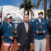 (L-R) Michael Annett, CEO RSL Victoria, competitor Maddison Inglis (WA), Consul General for the Republic of Turkey Mehmet Apak, competitor Jake Delaney (NSW) and former Australian player
and Davis Cup Captain John Fitzgerald with the Gallipoli Youth Cup trophies, which include sand from Gallipoli. (Photo credit: Elizabeth Xue Bai)