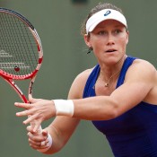 Sam Stosur in action against Monica Puig in her first round victory at Roland Garros; Elizabeth Xue Bai