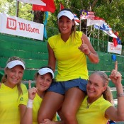 Australia's Junior Fed Cup team of (L-R) Maddison Inglis, Kimberly Birrell, Priscilla Hon and captain Louise Pleming celebrate Hon's 16th birthday in style with victory at the Asia/Oceania qualifying event in Kuching, Malaysia; Tennis Australia