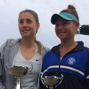 Sara Tomic (L) poses with the winning trophy after defeating Violet Apisah (R) in the final of the ITF Junior event in Kawana, Queensland; Tennis Australia