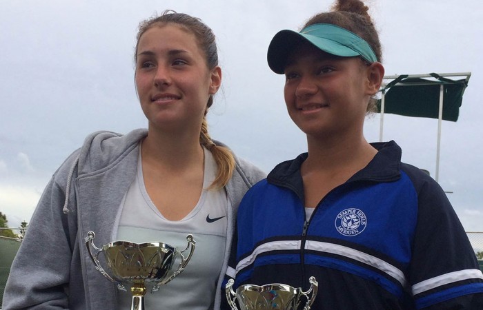 Sara Tomic (L) poses with the winning trophy after defeating Violet Apisah (R) in the final of the ITF Junior event in Kawana, Queensland; Tennis Australia