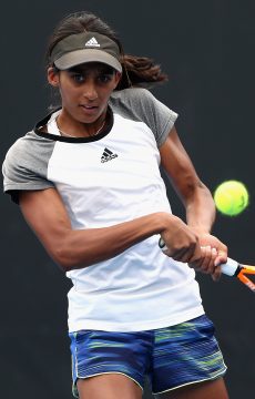 MELBOURNE, AUSTRALIA - DECEMBER 13:  Naiktha Bains of Australia plays a backhand in her singles match during the Australian Open December Showdown  at Melbourne Park on December 13, 2016 in Melbourne, Australia.  (Photo by Robert Prezioso/Getty Images)